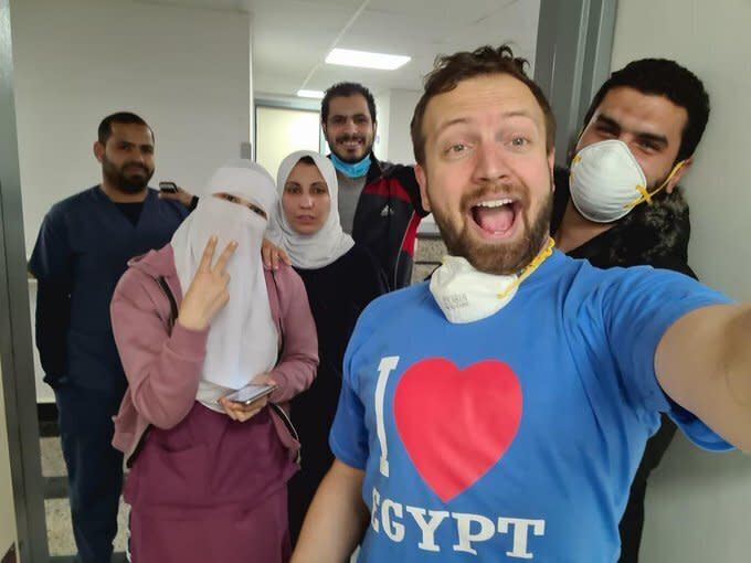 In this Friday, March 6, 2020 photo, provided by American tourist Matt Swider, posted on Twitter March 9, 2020, Matt Swider celebrates when his lab results for the new coronavirus came back negative, in Luxor Egypt, Egypt. Minutes later, his phone pinged: The tests had been mixed up. He was confirmed with the virus. Swider is since confined indefinitely to a remote hospital on Egypt’s north coast. For most people, the new coronavirus causes only mild or moderate symptoms. For some it can cause more severe illness. (Matt Swider via AP)