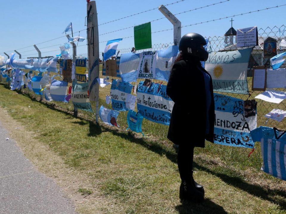 A woman reads the messages dedicated to the 44 crew members of the missing submarine ARA San Juan (EPA)