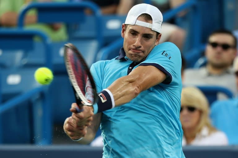 John Isner of the US returns a shot to compatriot Tommy Paul during their Cincinnati Open second round match, in Mason, Ohio, on August 15, 2017