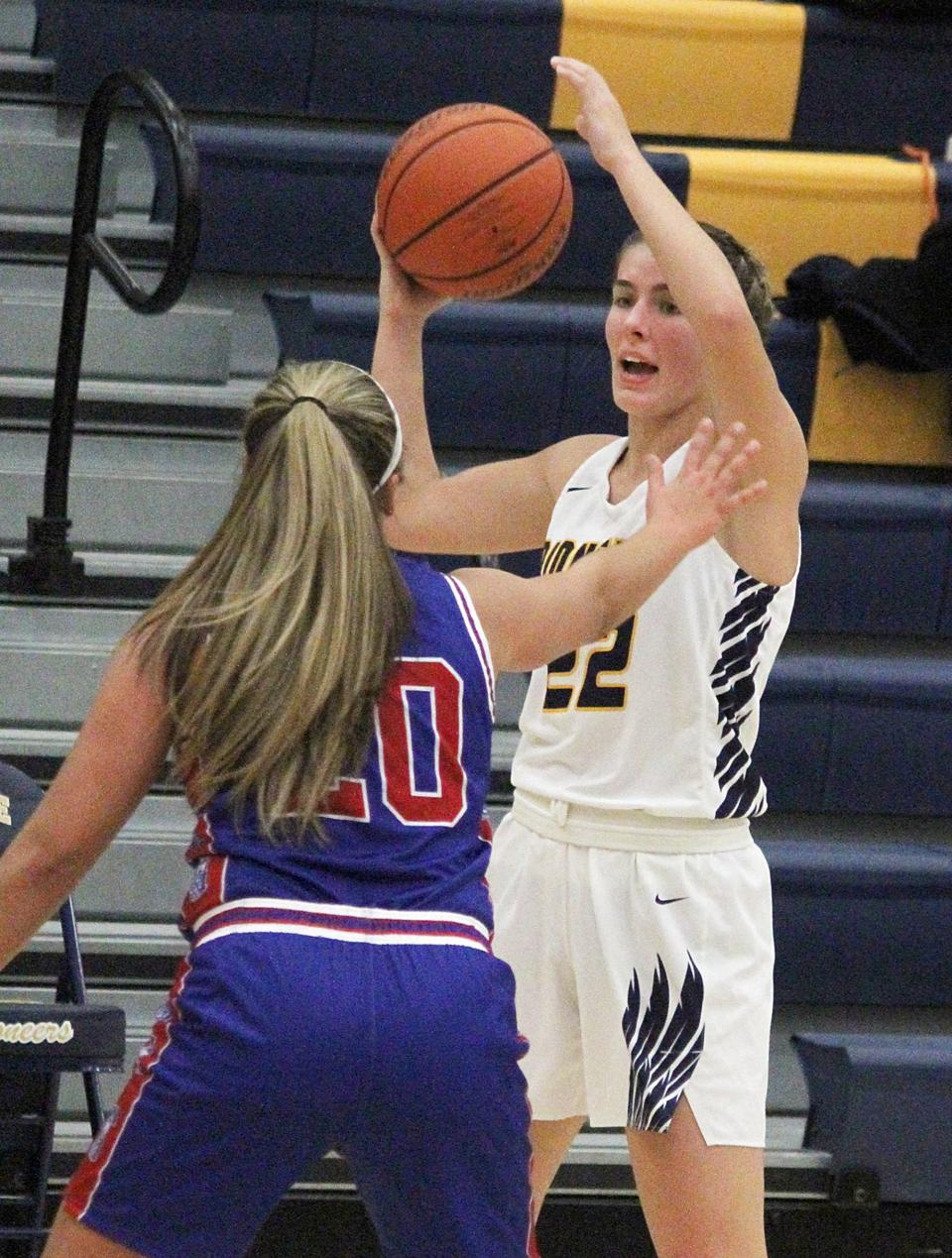 Mooresville senior Abigail Young (22) looks for an open teammate during Tuesday's Mid-State Conference game against Martinsville.