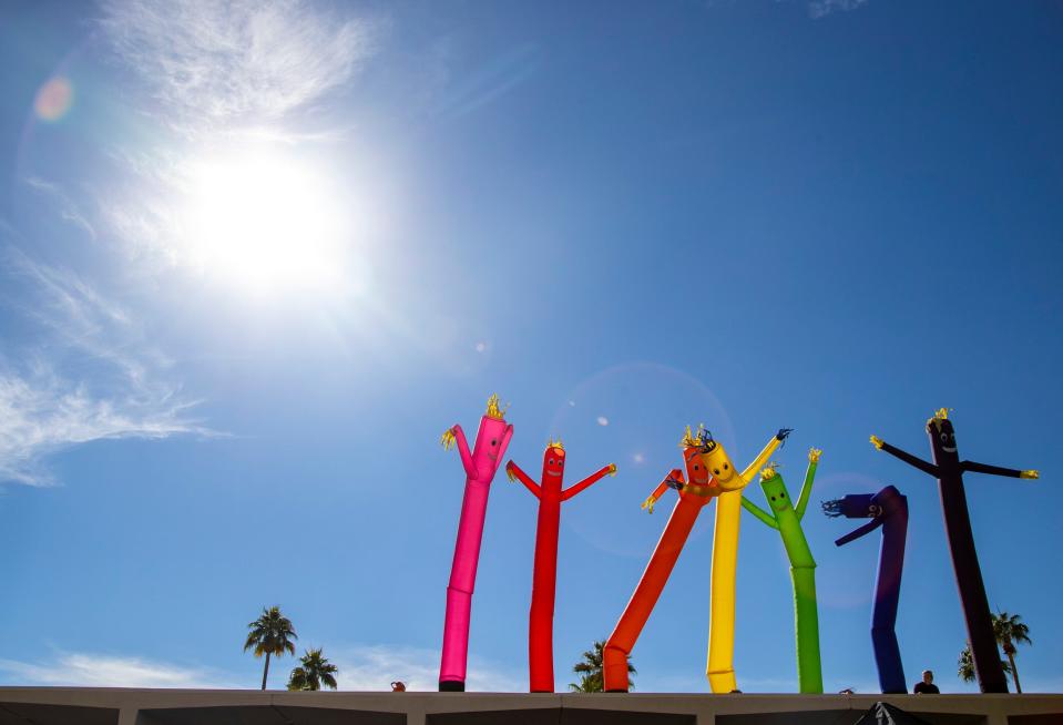 A line of rainbow-colored inflatables are seen on the rooftops of the bars on Arenas Road at the 36th annual Greater Palm Springs Pride Festival in Palm Springs, Calif., Saturday, Nov. 5, 2022. 