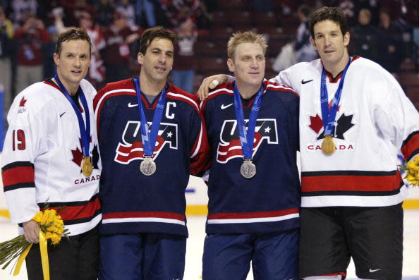 24 Feb 2002: (L-R) Steve Yzerman #19 of Canada, Chris Chelios #24 of the USA, Brett Hull #16 of the USA and Brendan Shanahan #14 of Canada pose with their medals after the mens ice hockey gold medal game of the Salt Lake City Winter Olympic Games at the E Center in Salt Lake City, Utah. They all play together in NHL with the Detroit Red Wings . DIGITAL IMAGE. Mandatory Credit: Jamie Squire/Getty Images