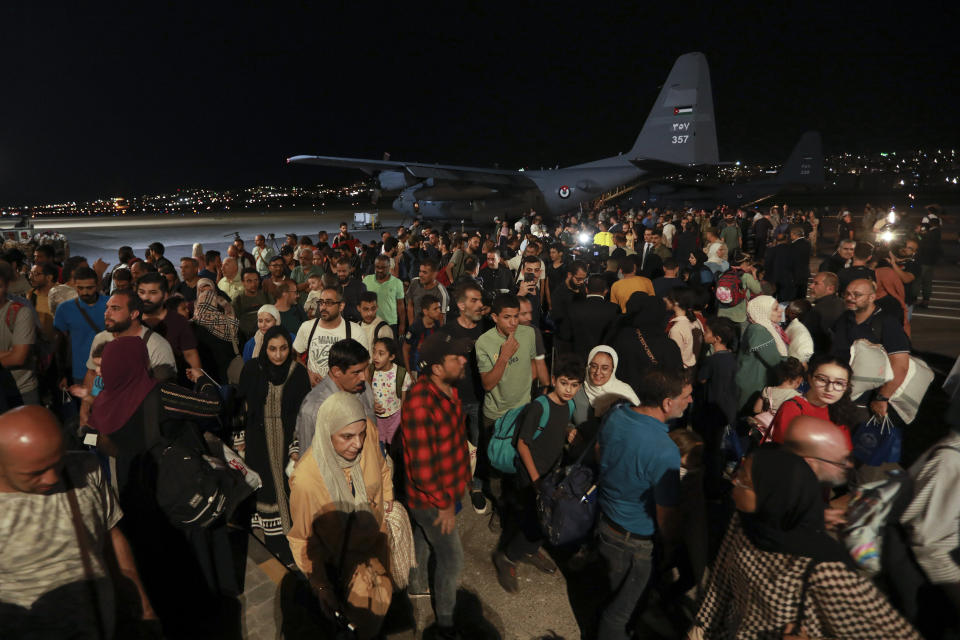 Jordanians evacuated from Sudan arrive at a military airport in Amman, Jordan, Monday, April 24, 2023. (AP Photo/Raad Adayleh)