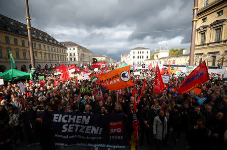 People gather to protest against populism, the trend towards the political right and the use of hate language during a demonstration in Munich, Germany, October 3, 2018. REUTERS/Michael Dalder