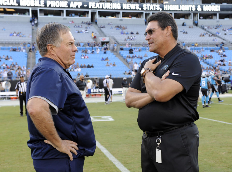 Carolina Panthers coach Ron Rivera, right, supports the idea Patriots coach Bill Belichick floated during last week's NFL spring meetings. (AP)
