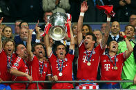 Captain Philipp Lahm of Bayern Muenchen lifts the trophy after winning the UEFA Champions League final match against Borussia Dortmund at Wembley Stadium on May 25, 2013 in London, United Kingdom.