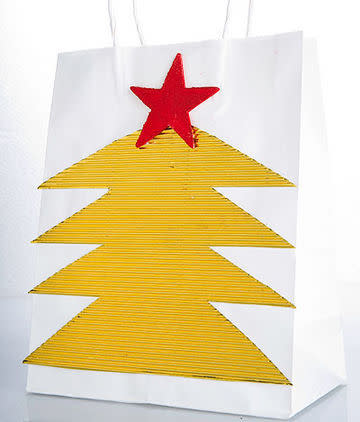 Don't let those odd shaped gifts throw you this Christmas. Simply pick up a plain paper bag (or recycle one), adorn it with this cute Christmas tree and voila! Wrapping made easy. <b>Click here for the full instructions!</b>