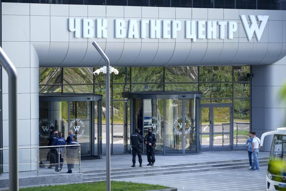 FILE - Policemen guard an area near an office of the 'PMC Wagner Centre', which is associated with the owner of the Wagner private military contractor, Yevgeny Prigozhin, in St. Petersburg, Russia, Saturday, June 24, 2023. Russian media including popular state TV channel Russia 1 — showed video of searches of Prigozhin's St. Petersburg offices and an opulent mansion he purportedly owned, complete with helipad and indoor swimming pool. (AP Photo, File)