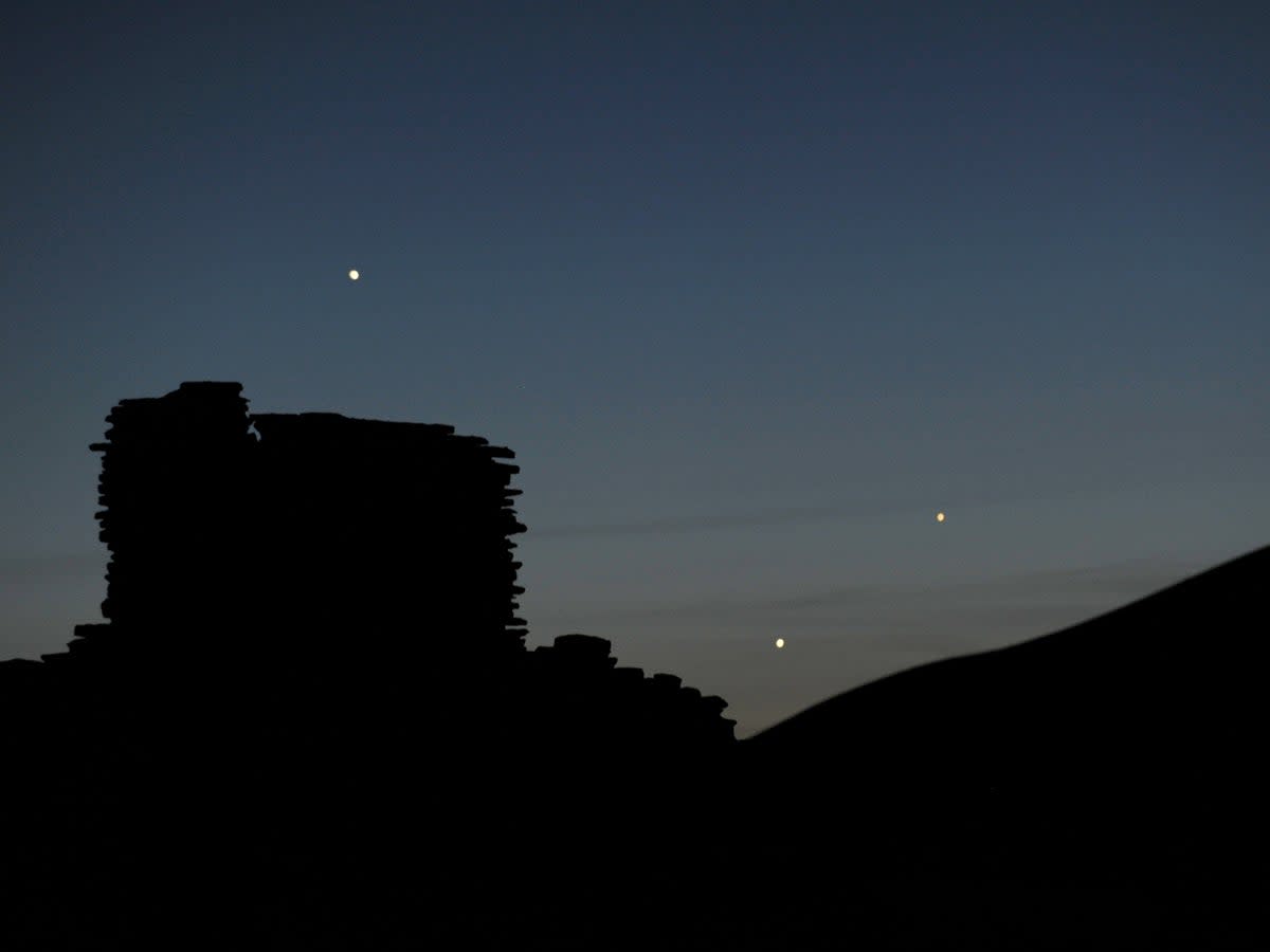 Venus and Jupiter appear in the night sky  (Stan Honda/AFP via Getty Images)