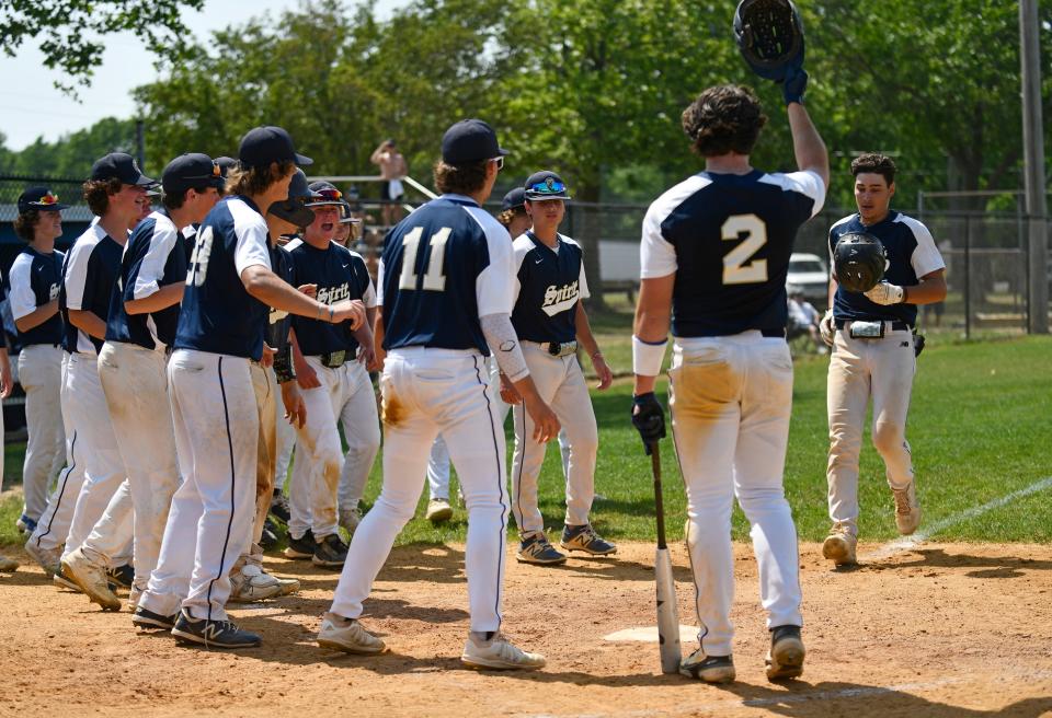 Holy Spirit celebrates a home run hit by Trevor Cohen (7) during Wednesday's playoff game against St. Joseph Academy. The Spartans defeated St. Joseph 8-5 in Hammonton. June 1, 2022.