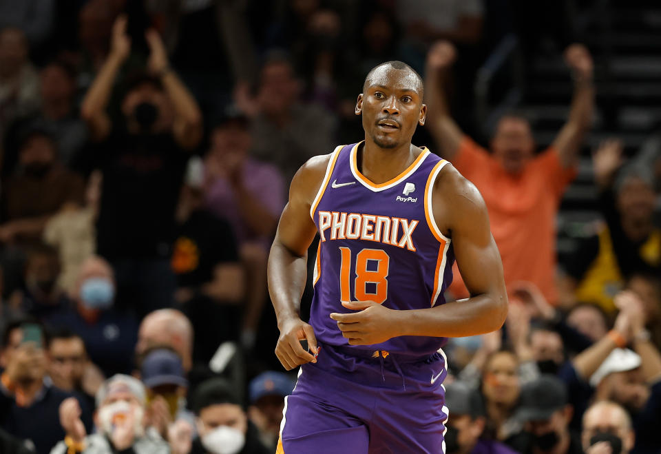 PHOENIX, ARIZONA - JANUARY 24: Bismack Biyombo #18 of the Phoenix Suns reacts after scoring against the Utah Jazz during the second half of the NBA game at Footprint Center on January 24, 2022 in Phoenix, Arizona. The Suns defeated Jazz 115-109. NOTE TO USER: User expressly acknowledges and agrees that, by downloading and or using this photograph, User is consenting to the terms and conditions of the Getty Images License Agreement.  (Photo by Christian Petersen/Getty Images)