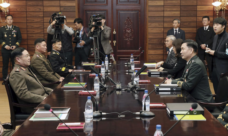 South Korean Maj. Gen. Kim Do-gyun, right, talks with his North Korean counterpart Lt. Gen. An Ik San during a meeting at the border village of Panmunjom, North Korea, Friday, Oct. 26, 2018. North and South Korea are holding military talks on their border to discuss implementing a broad-reaching military agreement last month to reduce tensions. (Korea Pool/Yonhap via AP)