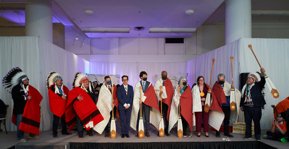 Representatives of First Nations with Richard Baker (center, in navy suit) flanked by Winnipeg Mayor Brian Bowman (left) and Prime Minister Trudeau and Grand Chief Jerry Daniels (far right).