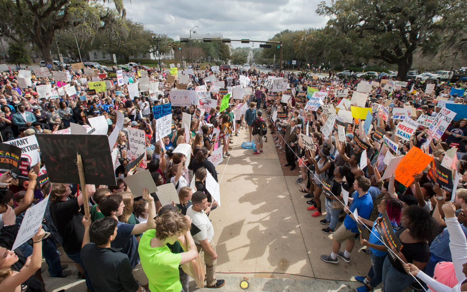 <p>Students gather on the steps of the old Florida Capitol protesting gun violence in Tallahassee, Fla., Wednesday, Feb. 21, 2018. Students at schools across Broward and Miami-Dade counties in South Florida planned short walkouts Wednesday, the one week anniversary of the deadly shooting at Marjory Stoneman Douglas High School. (Photo: Mark Wallheiser/AP) </p>