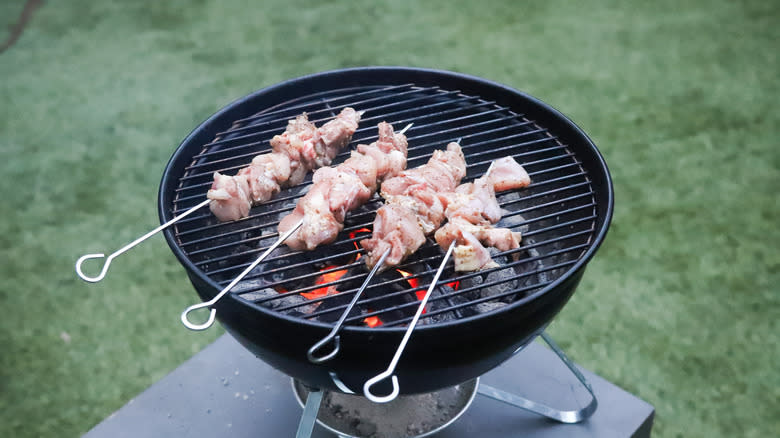 Chicken skewers on a grill