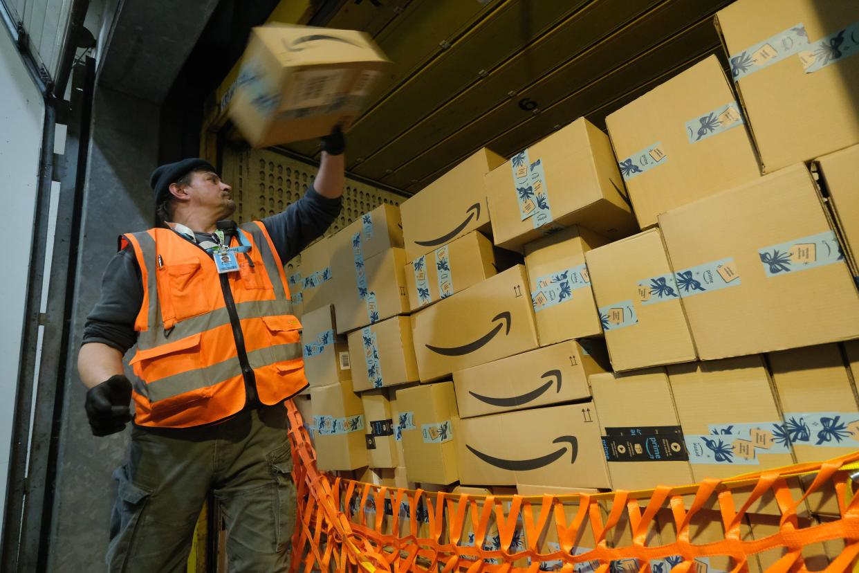 A worker loads a truck with packages at an Amazon packaging center on November 28, 2019 in Brieselang, Germany. (Photo by Sean Gallup/Getty Images) (Getty Images)