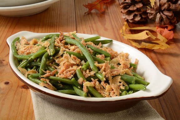 French cut green beans with crispy fried onions in a small casserole dish, a traditional holiday food; Shutterstock ID 229763227