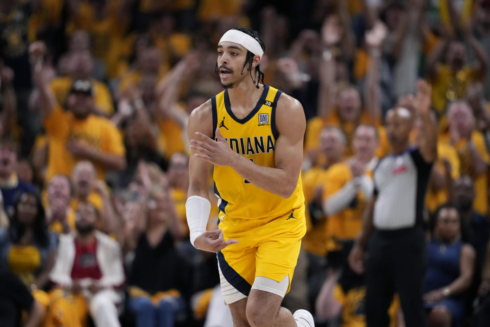 Indiana Pacers guard Andrew Nembhard celebrates after making a three-point basket during the first half of Game 3 of the NBA Eastern Conference basketball finals against the Boston Celtics, Saturday, May 25, 2024, in Indianapolis. (AP Photo/Michael Conroy)