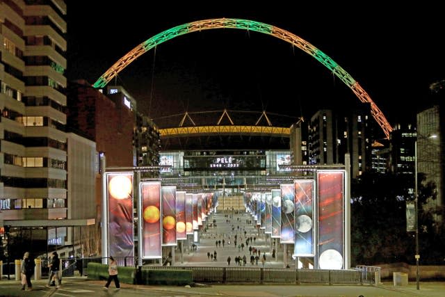 The Wembley arch is lit up in Brazil colours in memory of Pele