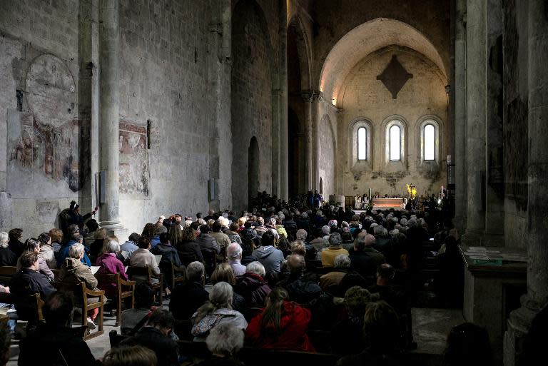 People attend a religious ceremony for victims of a Germanwings flight that crashed in the French Alps at Notre-Dame-du-bourg cathedral in Digne-les-Bains, France on March 28, 2015