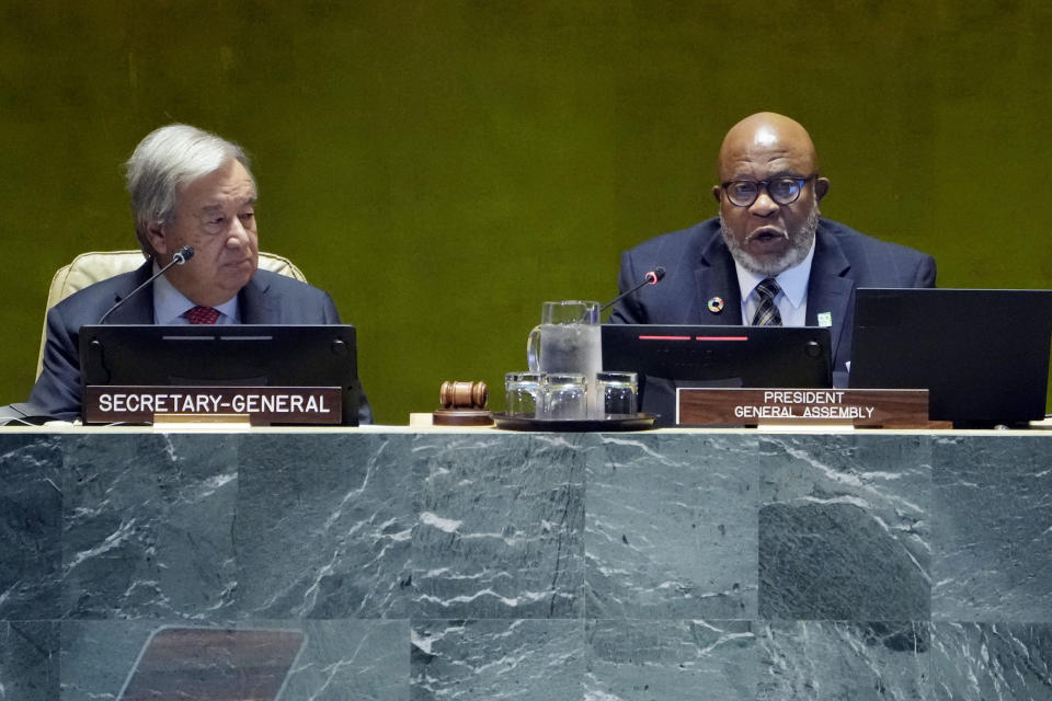 UN Secretary General Secretary General Antonio Guterres, left, listens as Dennis Francis, President of the 78th session of the General Assembly, addresses the United Nations Sustainable Development Forum, Monday, Sept. 18, 2023. (AP Photo/Richard Drew)