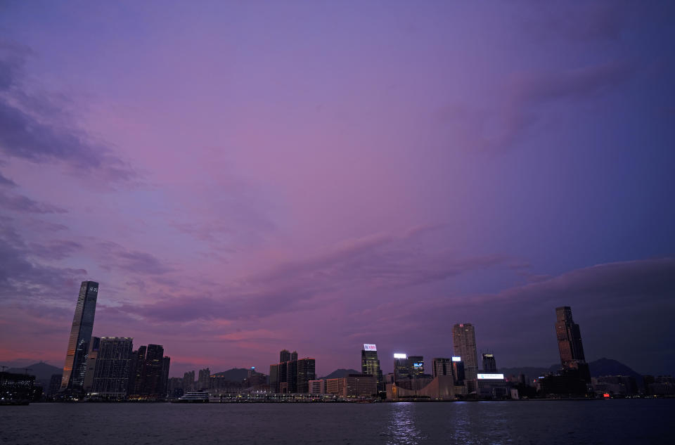 The skyline of the Kowloon area is silhouetted at sunset as typhoon Mangkhut is approaching Hong Kong Saturday, Sept. 15, 2018. Typhoon Mangkhut slammed into the Philippines' northeastern coast early Saturday and after the Philippines, the Hong Kong Observatory predicts Mangkhut will aim at the Chinese mainland south of Hong Kong and north of the island province of Hainan. (AP Photo/Vincent Yu)