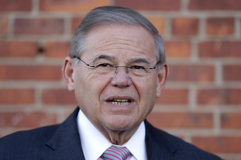 FILE - In this June 5, 2018 file photo, U.S. Sen. Bob Menendez speaks to reporters after casting his vote in the New Jersey primary election at the Harrison Community Center in Harrison, N.J. It’s less than three months until Election Day, and New Jersey residents are already seeing a barrage of ads in this year’s hotly contested U.S. Senate race. Menendez began a TV ad campaign last week, joining months’ worth of ads from Republican rival Bob Hugin. (AP Photo/Julio Cortez, File)