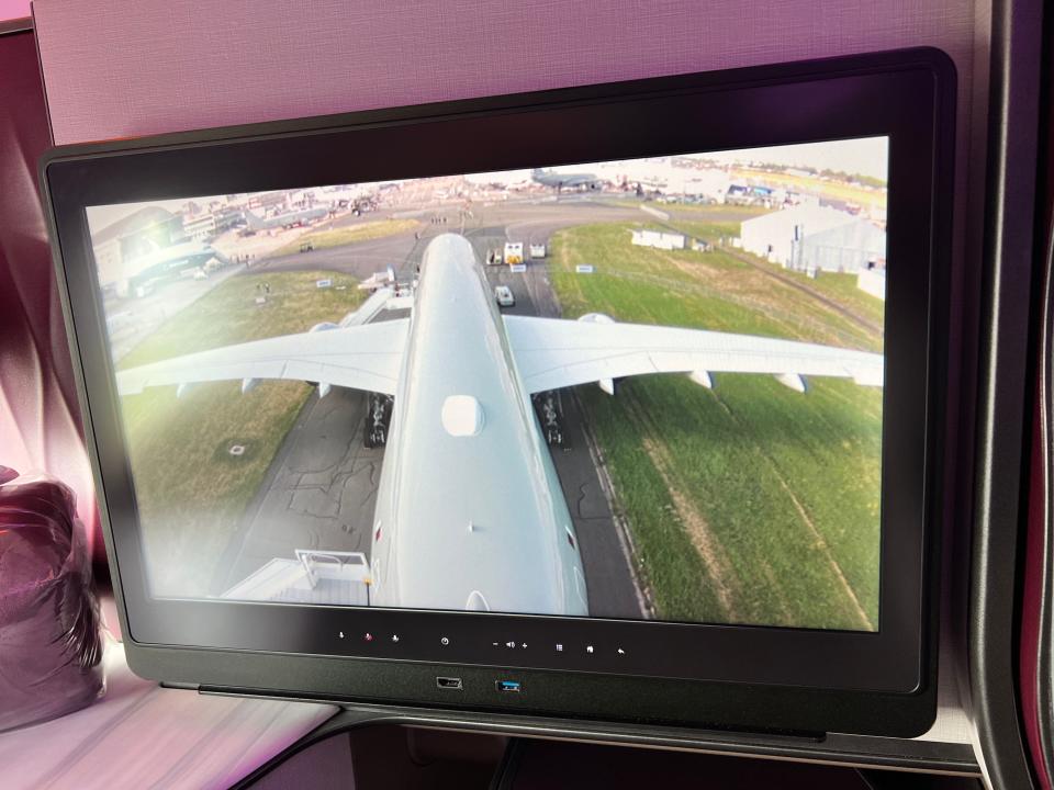 An Airbus A350 as seen from the tail cam, displayed on the screen in a business class seat