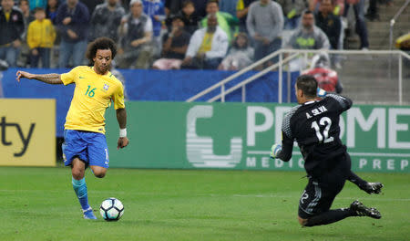 Football Soccer - Brazil v Paraguay - World Cup 2018 Qualifiers - Arena Corinthians stadium, Sao Paulo, Brazil - 28/3/17 - Brazil's Marcelo (16) scores a goal against Paraguay's goalkeeper Antony Silva. REUTERS/Nacho Doce