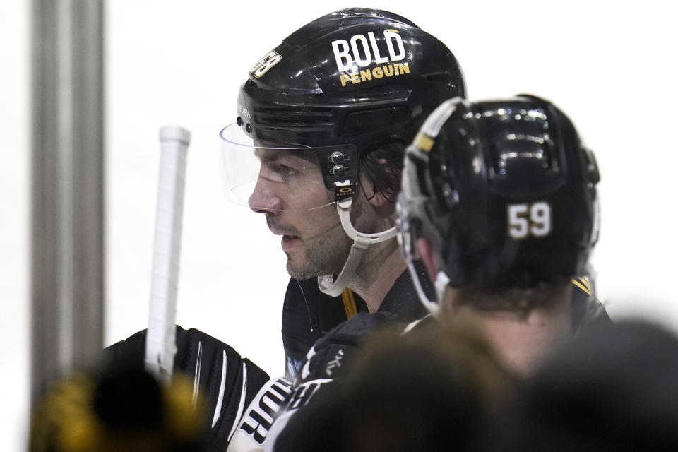 Pittsburgh Penguins' Kris Letang (58) returns to the bench after scoring against the Montreal Canadiens during the second period of an NHL hockey game in Pittsburgh, Tuesday, March 14, 2023. (AP Photo/Gene J. Puskar)