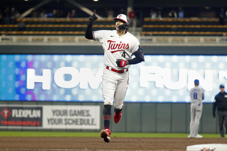 Minnesota Twins' Carlos Correa runs the bases on his solo home run against the Kansas City Royals during the fourth inning of a baseball game Thursday, April 27, 2023, in Minneapolis. (AP Photo/Bruce Kluckhohn)