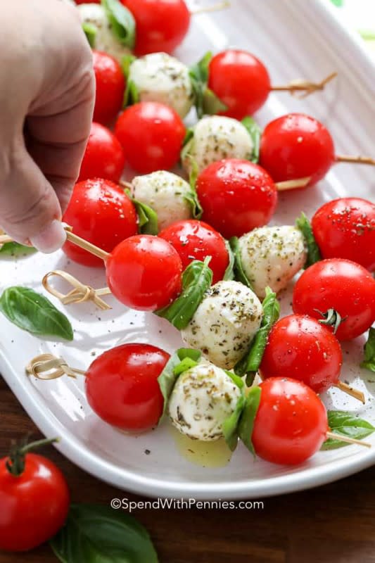 <p>Spend With Pennies</p><p>All the flavors of a refreshing caprese salad, on a stick!</p><p><strong>Get the recipe: <a href="https://www.spendwithpennies.com/caprese-skewers/" rel="nofollow noopener" target="_blank" data-ylk="slk:Caprese Skewers;elm:context_link;itc:0;sec:content-canvas" class="link rapid-noclick-resp">Caprese Skewers</a></strong></p>