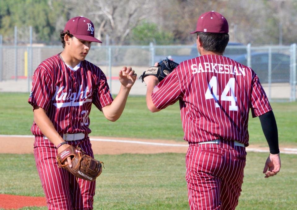 Riverside Prep's Logan Sarkesian, right, takes over on the mound for Jacob Villegas during the game against Excelsior on Friday, April 12, 2024.