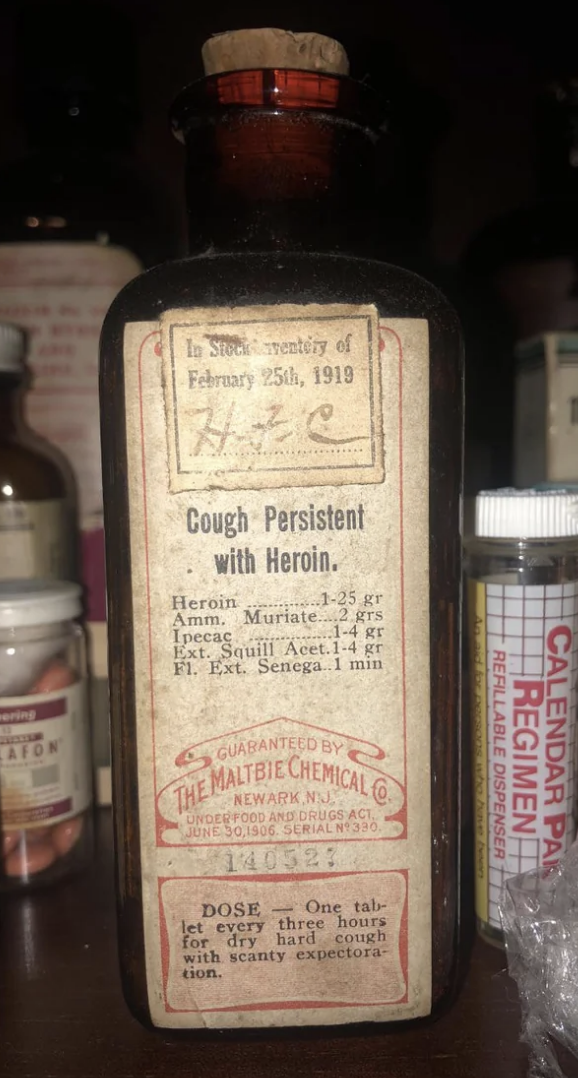 Vintage cough medicine bottle containing heroin, dated February 25, 1919, with detailed prescription label