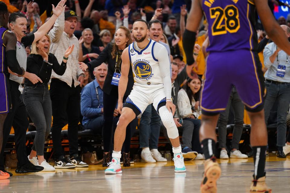 Golden State Warriors guard Stephen Curry (30) reacts after making a 3-point basket against the Los Angeles Lakers in the third quarter of Game 2  of their playoff series.