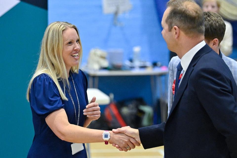 Conservative candidate Helen Hurford shakes hands with Lid Dem winner Richard Foord (AFP via Getty Images)