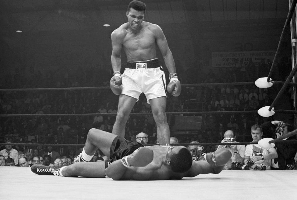 Muhammad Ali taunting Sonny Liston after knocking him out in 1965. (Photo: Getty Images).