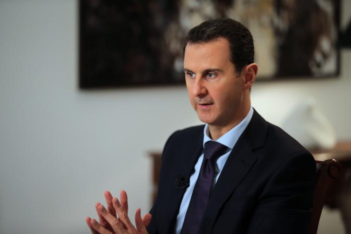 Syrian President Bashar Assad gestures during an interview with Agence France-Presse in Damascus in 2016.