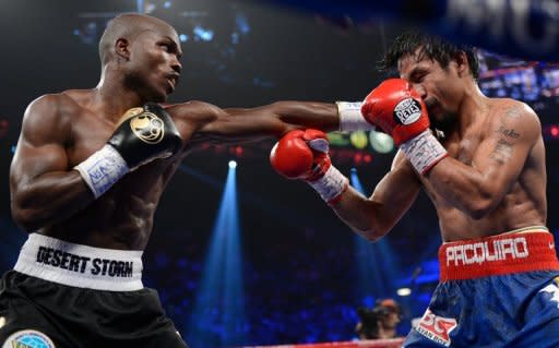 Timothy Bradley (L) lands a punch to the face of Manny Pacquiao during their WBO welterweight title fight at MGM Grand Garden Arena on June 9. Bradley ended Pacquiao's 15-fight winning streak with a split decision victory, seizing the Filipino icon's WBO welterweight title