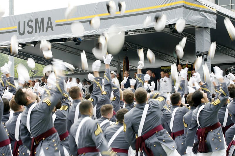 President George W. Bush watches the graduates throw up their hats at Michie Stadium for the 2006 Graduation Ceremony of the U.S. Military Academy in West Point, N.Y., on May 27, 2006. On March 16, 1802, the U.S. Congress authorized the establishment of the U.S. Military Academy in West Point, N.Y. File Photo by John Angelillo/UPI