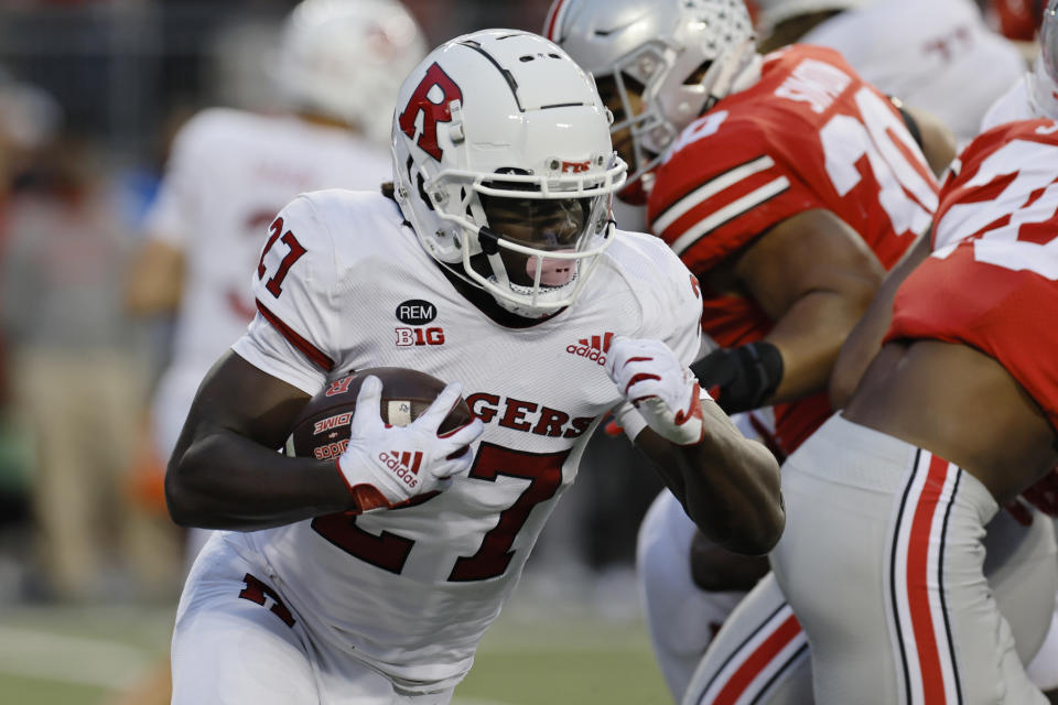Rutgers running back Samuel Brown, left, runs up field against Ohio State during the second half of an NCAA college football game, Saturday, Oct. 1, 2022, in Columbus, Ohio. (AP Photo/Jay LaPrete)
