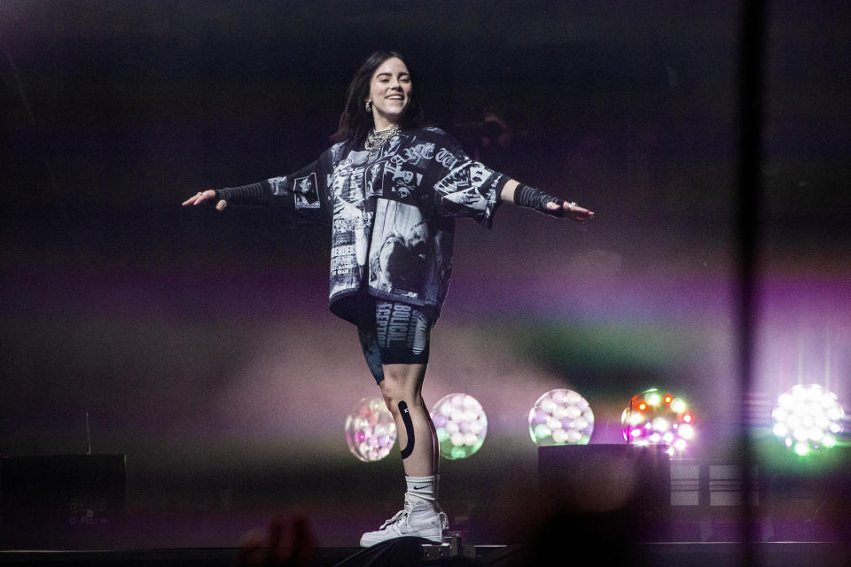 FILe - Billie Eilish performs on the Pyramid main stage at Glastonbury Festival, in Worthy Farm, Somerset, England, Friday, June 24, 2022. Music superstars Lenny Kravitz, Billie Eilish and H.E.R. will team with advocacy nonprofit Global Citizen for a concert in front of the Eiffel Tower designed to convince world leaders to take further action against climate change. (Photo by Joel C Ryan/Invision/AP, File)