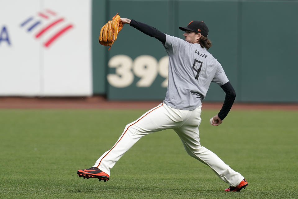 San Francisco Giants pitcher Kevin Gausman throws during a baseball practice in San Francisco, Tuesday, Oct. 5, 2021. (AP Photo/Jeff Chiu)