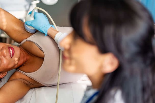STOCK PHOTO: A doctor performs ultrasound examination of breast of a patient in a clinic (STOCK PHOTO/Getty Images)
