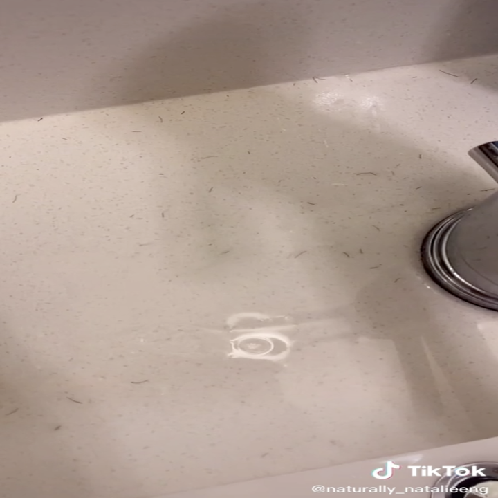 Image of sink with hair.