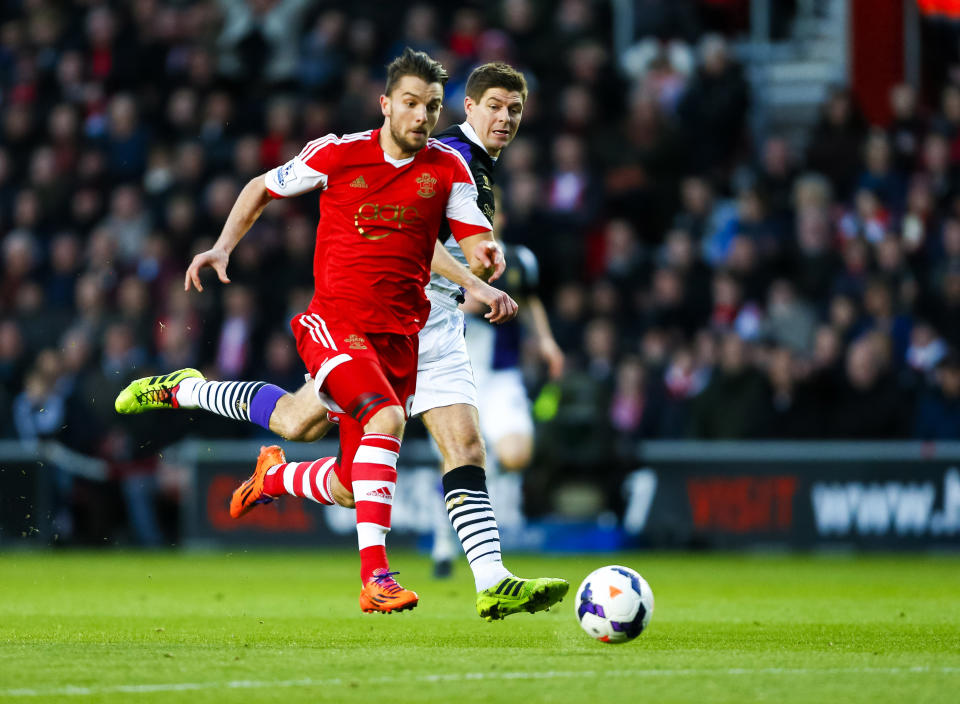 Southampton's Jay Rodriguez, left, gets past Liverpool's Steven Gerrard, during their English Premier League match, at St Mary's, Southampton, England, Saturday March 1, 2014. (AP Photo/PA, Chris Ison) UNITED KINGDOM OUT