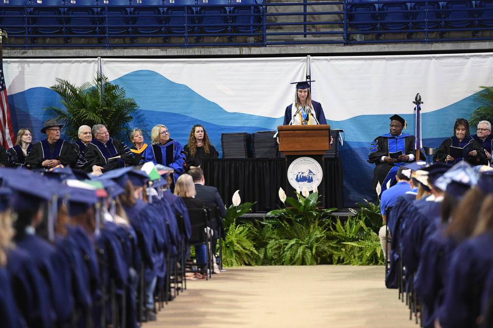 Manly E. Wright Award recipient Ona Elkins speaks with her classmates during UNC Asheville's commencement ceremony at Kimmel Arena, May 11, 2024.