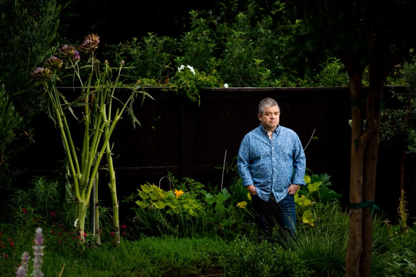 STUDIO CITY, CA - JUNE 19: Comedian, actor, writer and producer Patton Oswalt, is photographed in promotion of the HBO docuseries he executive produced, "I'll Be Gone In The Dark," about the Golden State Killer, in the yard, of his Studio City, CA, home, on Friday, June 19, 2020. The six-part documentary series is based on the book by Oswalt's late wife Michelle McNamara, titled, "I'll Be Gone in the Dark: One Woman's Obsessive Search for the Golden State Killer," which Patton helped finish. (Jay L. Clendenin / Los Angeles Times)