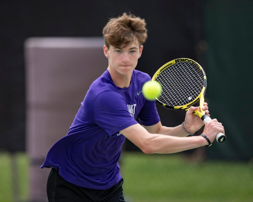 Topeka West's Ian Cusick returns the ball on day one of the state tournament Friday at Kossover Tennis Court.