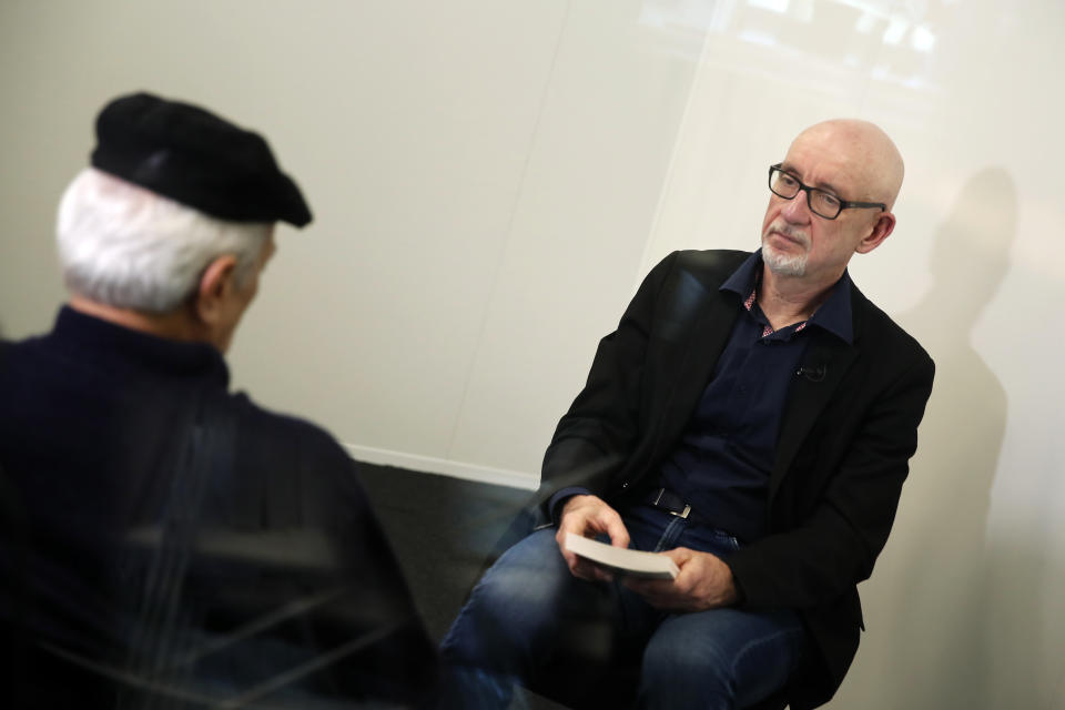 George Salines, right, whose daughter died in the Bataclan concert hall during the Nov. 13, 2015, attacks in Paris, and has written a book with Azdyne Amimour, left, whose son was among the gunmen that night, attend a joint interview in Paris, Tuesday Jan. 21, 2020. Both men lost children that night. The book, "We Still Have Words" is written as a dialogue between the two, to teach tolerance and resilience at a time when they say both seem in short supply. (AP Photo/Francois Mori)